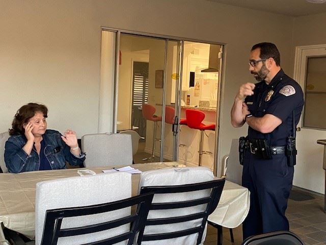 Police Talking with Woman